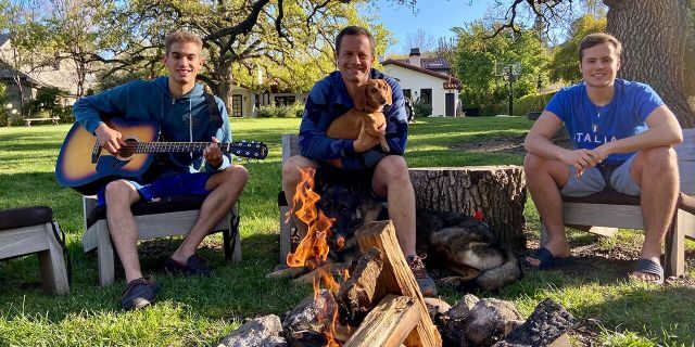 ‘Growing Pains’ star Kirk Cameron is seen quarantining with his sons Luke, left, and James, right as the trio gather around a backyard campfire amid the coronavirus pandemic