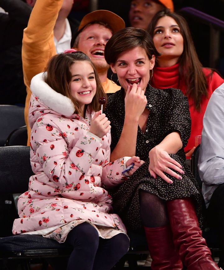 Suri Cruise and Katie Holmes attend an NBA game in 2017.