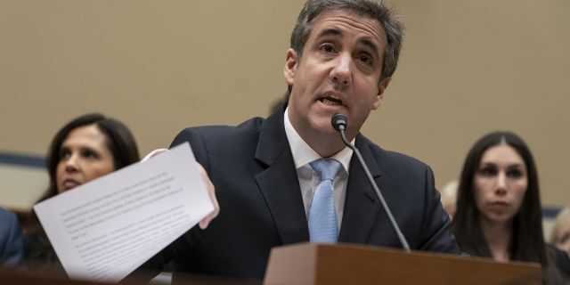 Michael Cohen, President Donald Trump's former personal lawyer, reads an opening statement as he testifies before the House Oversight and Reform Committee on Capitol Hill in Washington. Cohen will be released from prison early due to the coronavirus pandemic, a source familiar with the case told Fox News late Thursday. (AP Photo/J. Scott Applewhite, File)