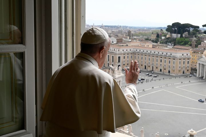 Pope Francis delivering a blessing from the window of his private library overlooking an empty St. Peter's Square on Monday.&