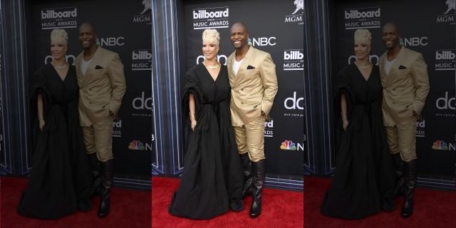 Rebecca King-Crews, in a black gown, and Terry Crews, in a gold suit, were all smiles at the Billboard Music Awards.