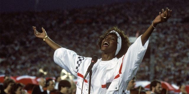 Whitney Houston sings the National Anthem before a game with the New York Giants taking on the Buffalo Bills prior to Super Bowl XXV at Tampa Stadium on January 27, 1991, in Tampa, Fla. 