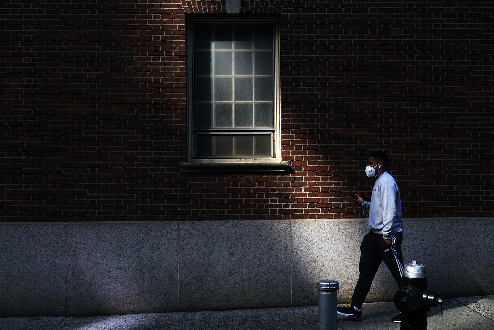 A man walks through the Financial District on May 11, in New York City. 