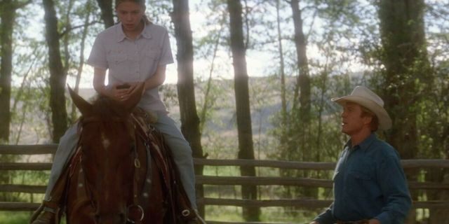 Scarlett Johansson (L) and Robert Redford (R) in the 'Horse Whisperer.'