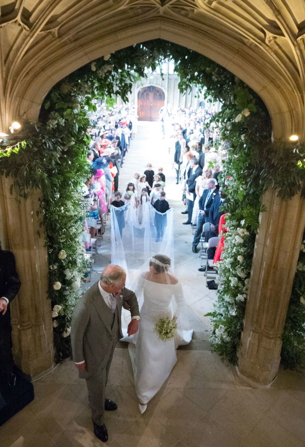 Meghan walks up the aisle with Prince Charles, the Prince of Wales.&nbsp;