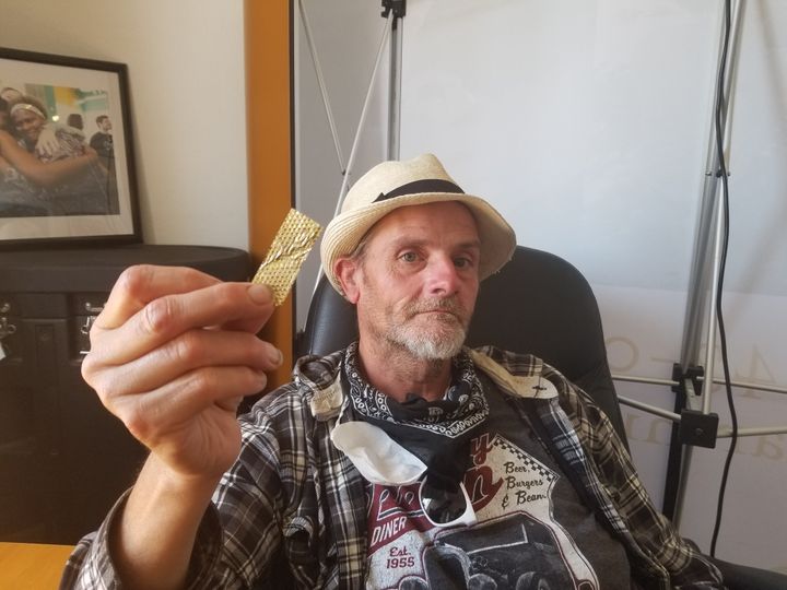 Derek "D-Rock" Williams with a piece of the golden glitter from the "America's Got Talent" audition.