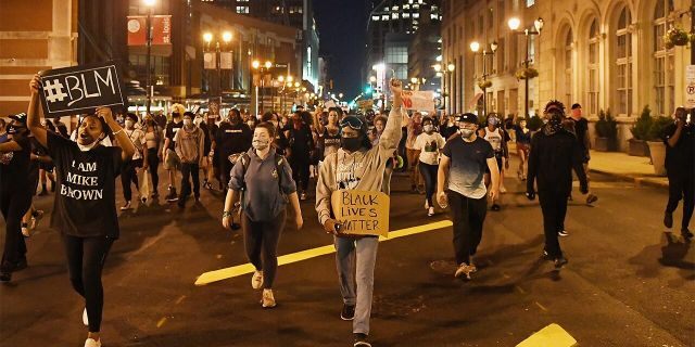 Protesters rally as they march through the streets on May 29 in St Louis, Missouri.