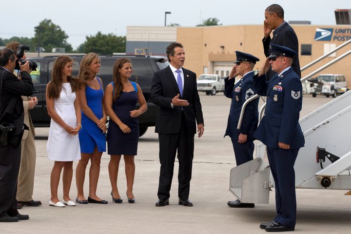 The governor and his daughters, Cara, Mariah and Michaela, greet President Barack Obama in 2013.