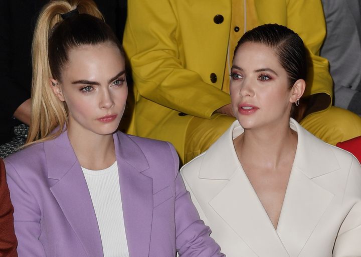 Cara Delevingne and Ashley Benson attend the Boss fashion show in February 2020.