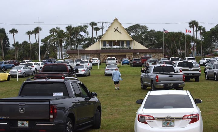 People in cars attend services at a Daytona Beach church on Easter Sunday.