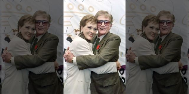 US director Blake Edwards poses with his wife Julie Andrews, after receiving the Legion of Honor, on May 09, 1992, during the International Cannes Film Festival.