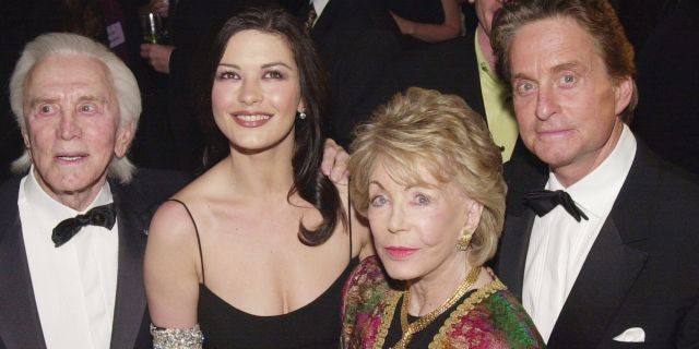 Kirk Douglas, Catherine Zeta-Jones, Anne Douglas, and Michael Douglas arrive at 'An Unforgettable Evening' presented by Saks Fifth Avenue benefitting Cedars-Sinai Medical Center March 27, 2001, at the Regent Beverly Wilshire Hotel in Beverly Hills, CA.