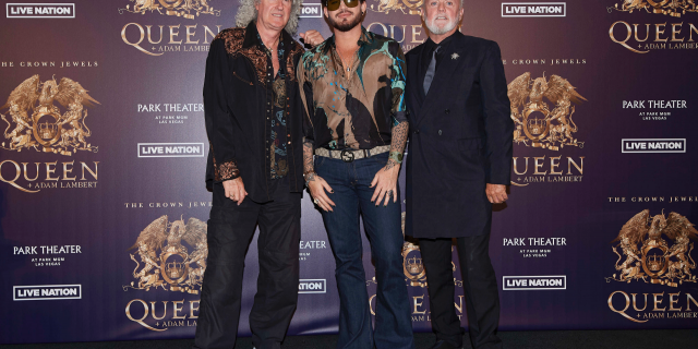 Brian May, from left, Adam Lambert, and Roger Taylor of Queen + Adam Lambert pose for a photo at the "The Crown Jewels" residency press conference at the MGM Resorts aviation hanger in Las Vegas. 