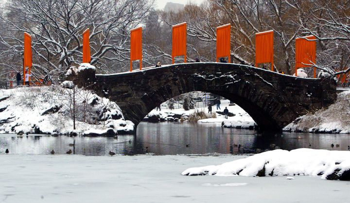 "The Gates" art installation created by Christo and Jeanne-Claude lines a snow-covered bridge in New York's Central Park in 2