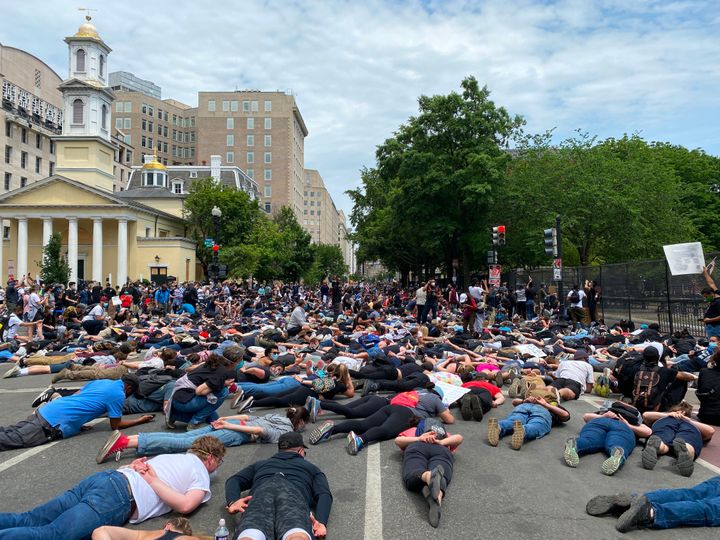Protesters lie down in front of Lafayette Square and St. John's Episcopal Church on Tuesday.