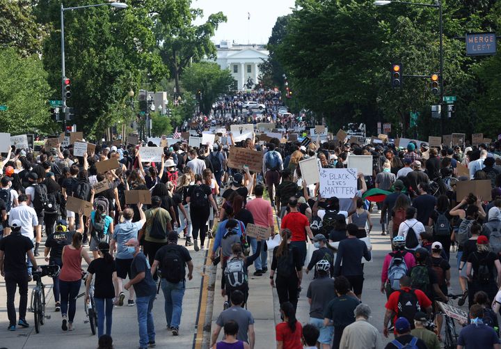 Hundreds of demonstrators march toward Lafayette Park and the White House to protest against police brutality and the death o