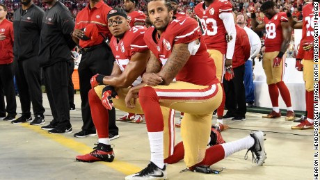 Colin Kaepernick #7 and Eric Reid #35 of the San Francisco 49ers kneel in protest during the national anthem prior to playing the Los Angeles Rams in their NFL game at Levi&#39;s Stadium on September 12, 2016. 