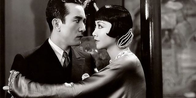 Actress Anna May Wong and Sessue Hayakawa with Harold Minjir in a scene from the movie 'Daughter of the Dragon.'