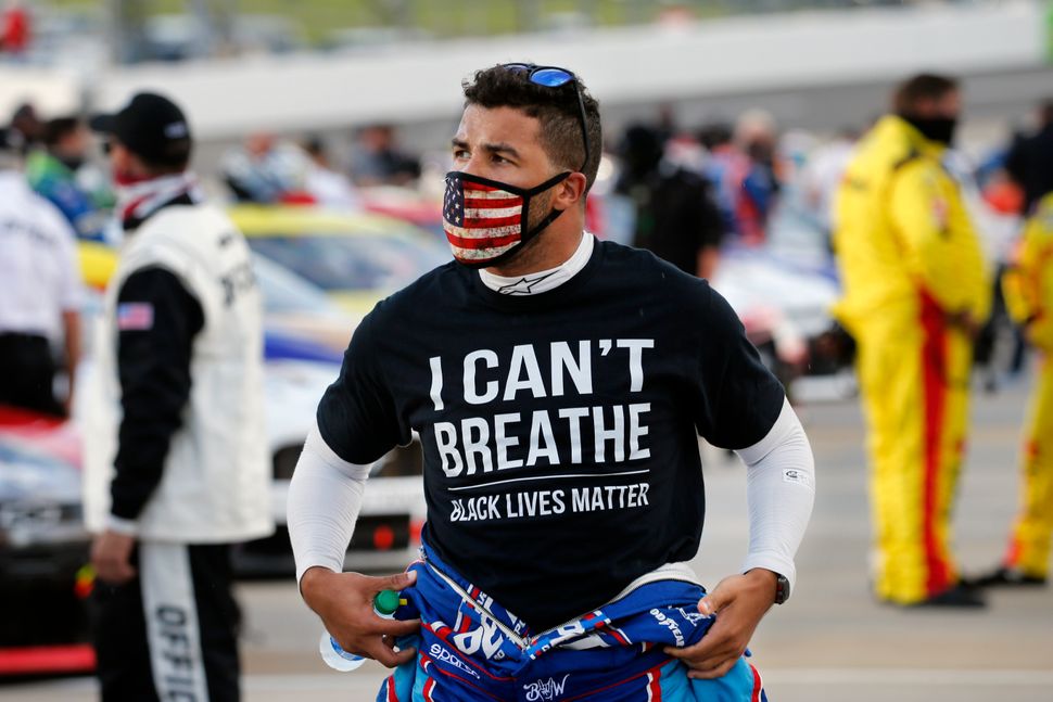 Driver Bubba Wallace wears a Black Lives Matter shirt as he prepares for a NASCAR Cup Series auto race on June 10 in Martinsv