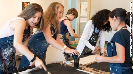 Children painting at Evanston Art Center&#39;s summer camp in 2019. 