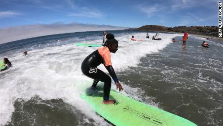 Children surfing with the City Surf Project summer camp in 2019.