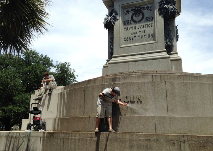 In this June 23, 2015, file photo, Joe Patrizzi III power-washes graffiti from a statue in Charleston, South Carolina, of Joh