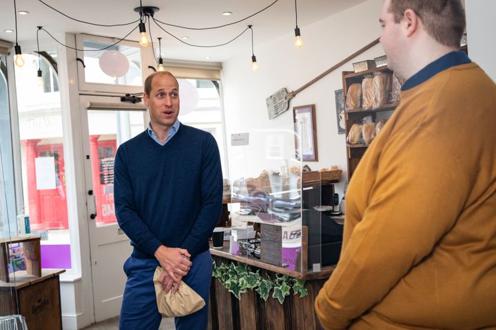 William speaks to staff member Ted Bartram during a Friday visit to Smiths the Bakers in King's Lynn.