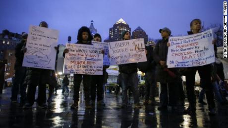 Protesters hold banners in support of Eric Garner at Union Square on December 3, 2014, in New York City. Garner died after being put in a chokehold during an alteration with NYPD officers.