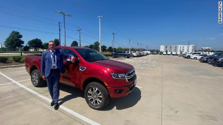 Brian Huth of Sam Pack&#39;s Five Star Ford in Texas stands next to one of the few Ford Rangers he has left to sell.