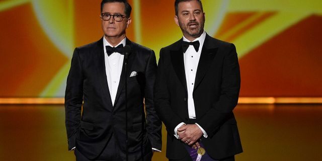 Stephen Colbert, left, and Jimmy Kimmel present the award for outstanding lead actress in a comedy series at the 71st Primetime Emmy Awards on Sunday, Sept. 22, 2019.