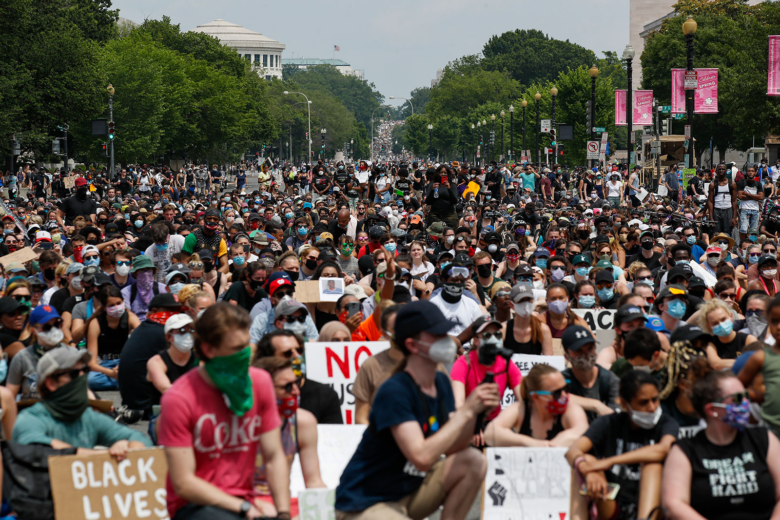 Demonstrators flood the streets of Washington on Saturday, June 6