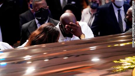 Philonise Floyd, brother of George Floyd, pauses at the casket during the funeral.