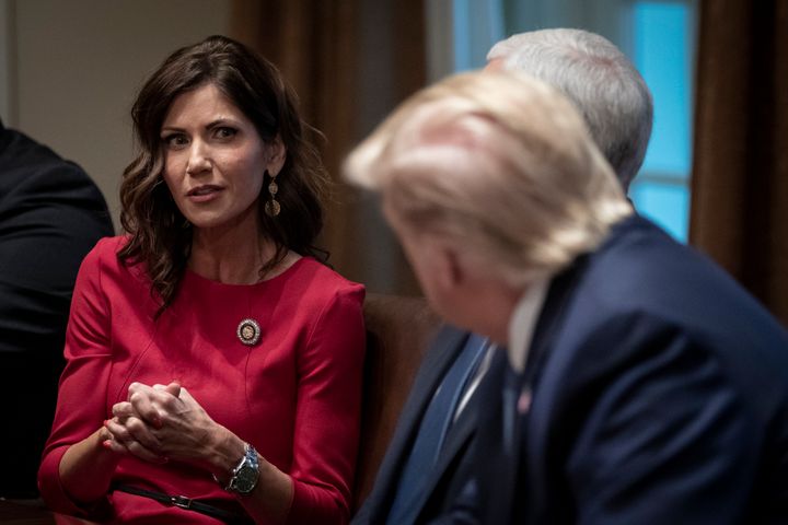 South Dakota Gov. Kristi Noem (R) and President Donald Trump at a meeting in December. The president is planning to speak at 