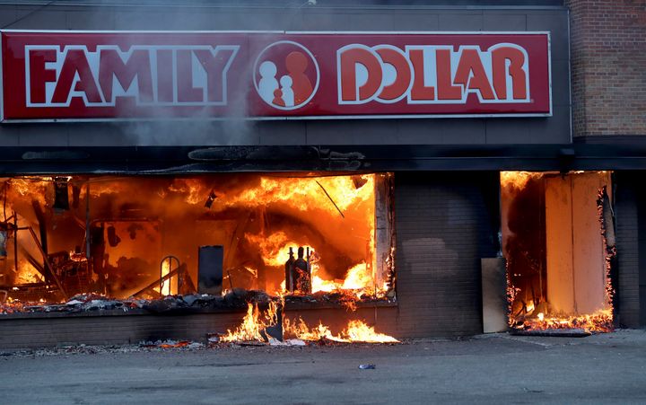 Fire burns inside a Family Dollar Store, where many community members buy groceries, after a night of unrest in Minneapolis on Friday, May 29.