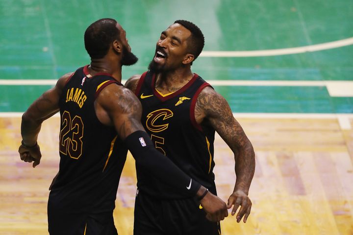 J.R. Smith, right, celebrates a playoff victory in 2018 with LeBron James.