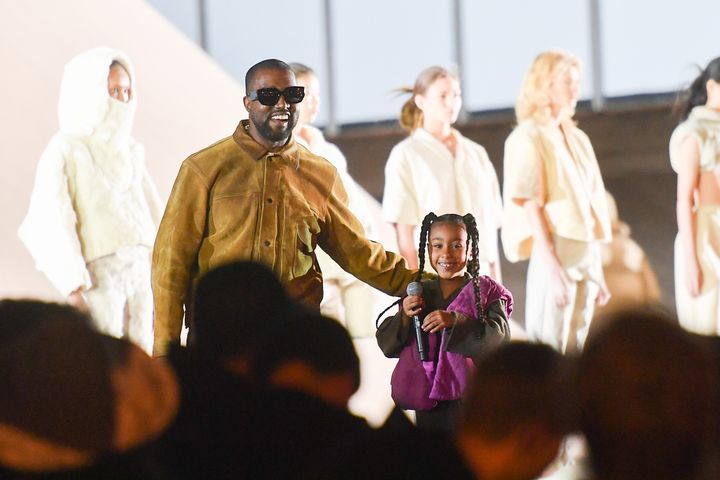 Kanye West and his daughter North West on the runway during the "Yeezy Season 8" show in March in Paris. West is starting a l