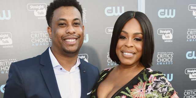 Dominic Nash (L) and Niecy Nash attend Moet &amp; Chandon celebrate The 23rd Annual Critics' Choice Awards at Barker Hangar on January 11, 2018, in Santa Monica, Calif. 