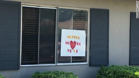 Signs in the windows of Bel Tooren express gratitude for nursing home employees during the pandemic.