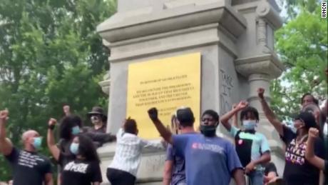 Protesters in Raleigh replace the inscription on a confederate monument with a memorial For George Floyd.
