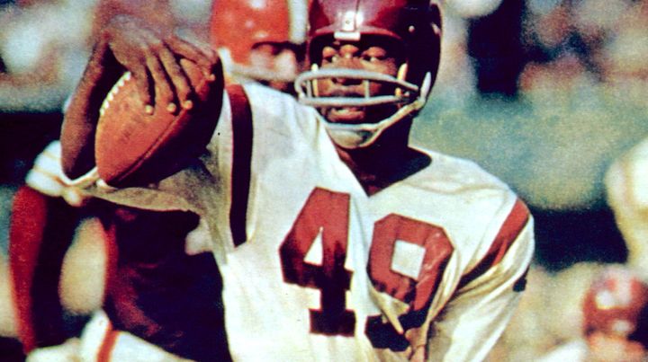 The Washington football team has retired the late Bobby Mitchell's jersey number. Here, he is pictured doing a spin move in a