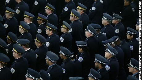 Officers attend the funeral Mass in 2018 of Chicago police Cmdr. Paul Bauer.
