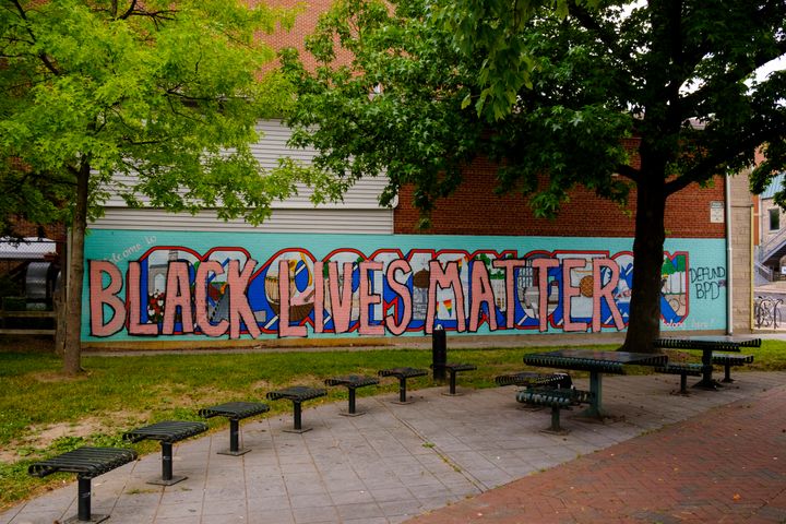 The words "Black Lives Matter" are painted over a mural in Bloomington, Indiana, on June 19. Bloomington is about 70 miles so
