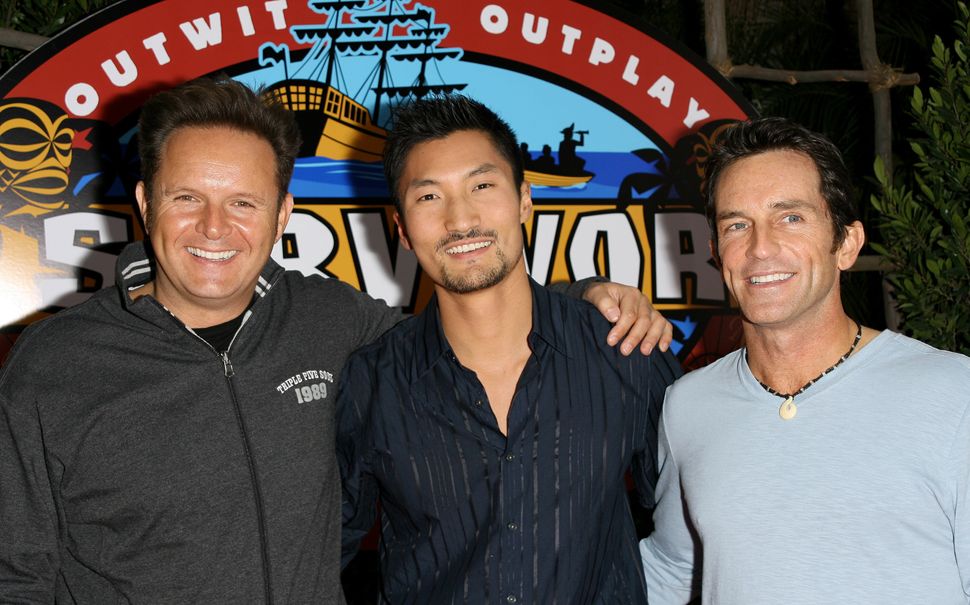 Mark Burnett (left) and Kwon (center), who won Season 13 of "Survivor."&nbsp;