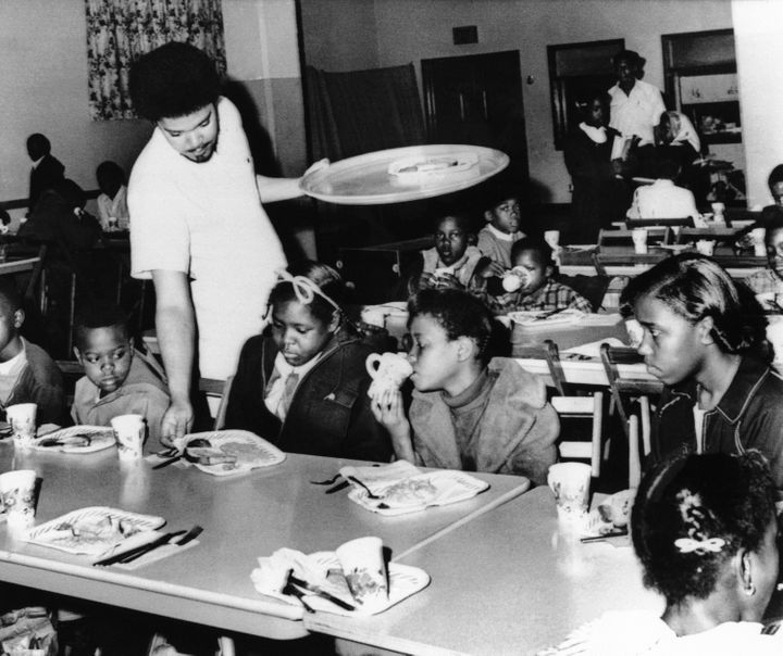 A member of the Black Panther chapter in Kansas City serves free breakfast to children in April 1969 before they go to school