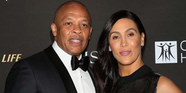 Rapper and music producer Dr. Dre, left, and his wife Nicole Young, right, attend the City Of Hope Gala on October 11, 2018, in Los Angeles, Calif. 