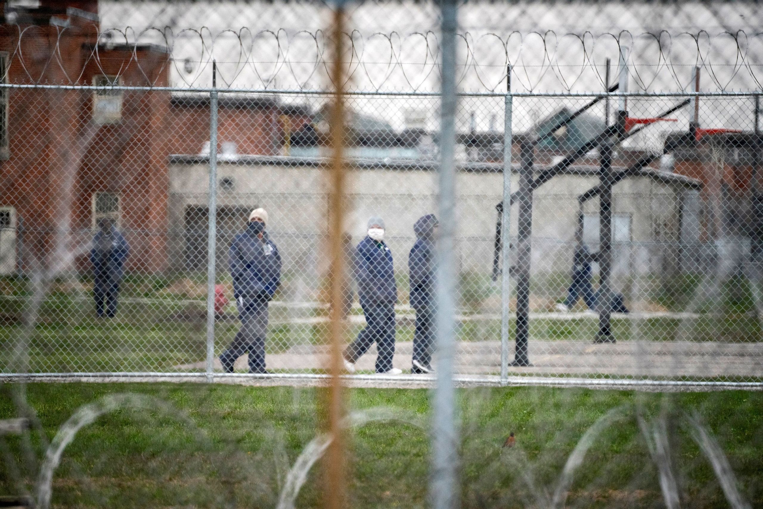 People walk in the yard at Marion Correctional Institution on April 22, just after the prison completed mass testing for the 