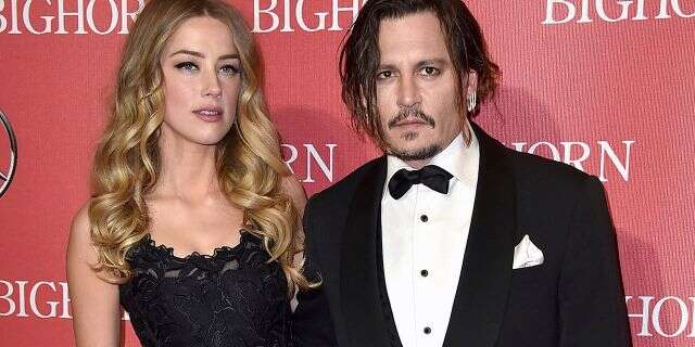 In this Jan. 2, 2016, file photo, Amber Heard, left, and Johnny Depp arrive at the 27th annual Palm Springs International Film Festival Awards Gala in Palm Springs, Calif. 