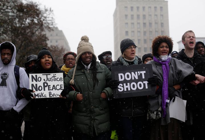 Demonstrators in November 2014 protest the killing of Michael Brown by a Ferguson, Missouri, police officer months earlier.