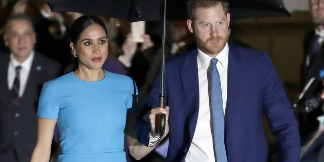 FILE - Prince Harry and Meghan, the Duke and Duchess of Sussex arrive at the annual Endeavour Fund Awards in London on March 5, 2020. The couple is suing to stop the sale of a photo of their son Archie that they say was shot at their Los Angeles-area home in invasion of their privacy. 
