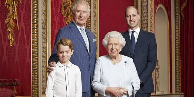 Queen Elizabeth, Prince Charles, Prince William and Prince George pose for a photo to mark the start of the new decade in the Throne Room of Buckingham Palace, London.
